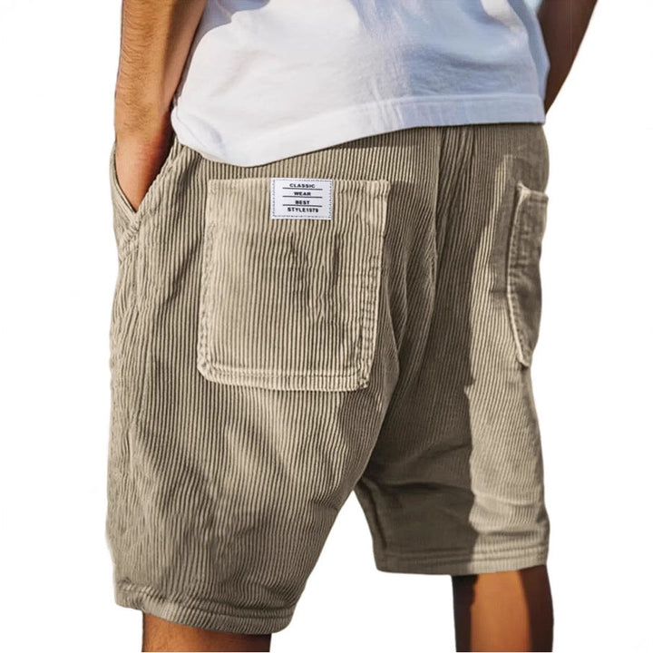 Textured men's casual shorts, elastic waist & patch pocket. Urban style, comfortable summer wear.