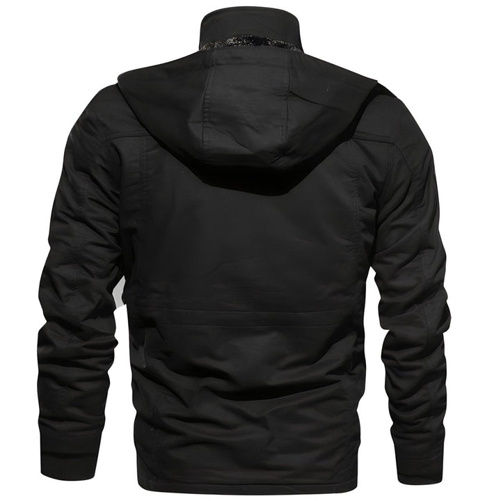 Close-up of the multi-pocket detail on a men's hooded utility jacket, emphasizing functionality.