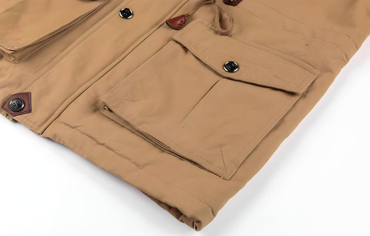 Side profile of a men's casual hooded utility jacket, highlighting its comfortable, adjustable fit.