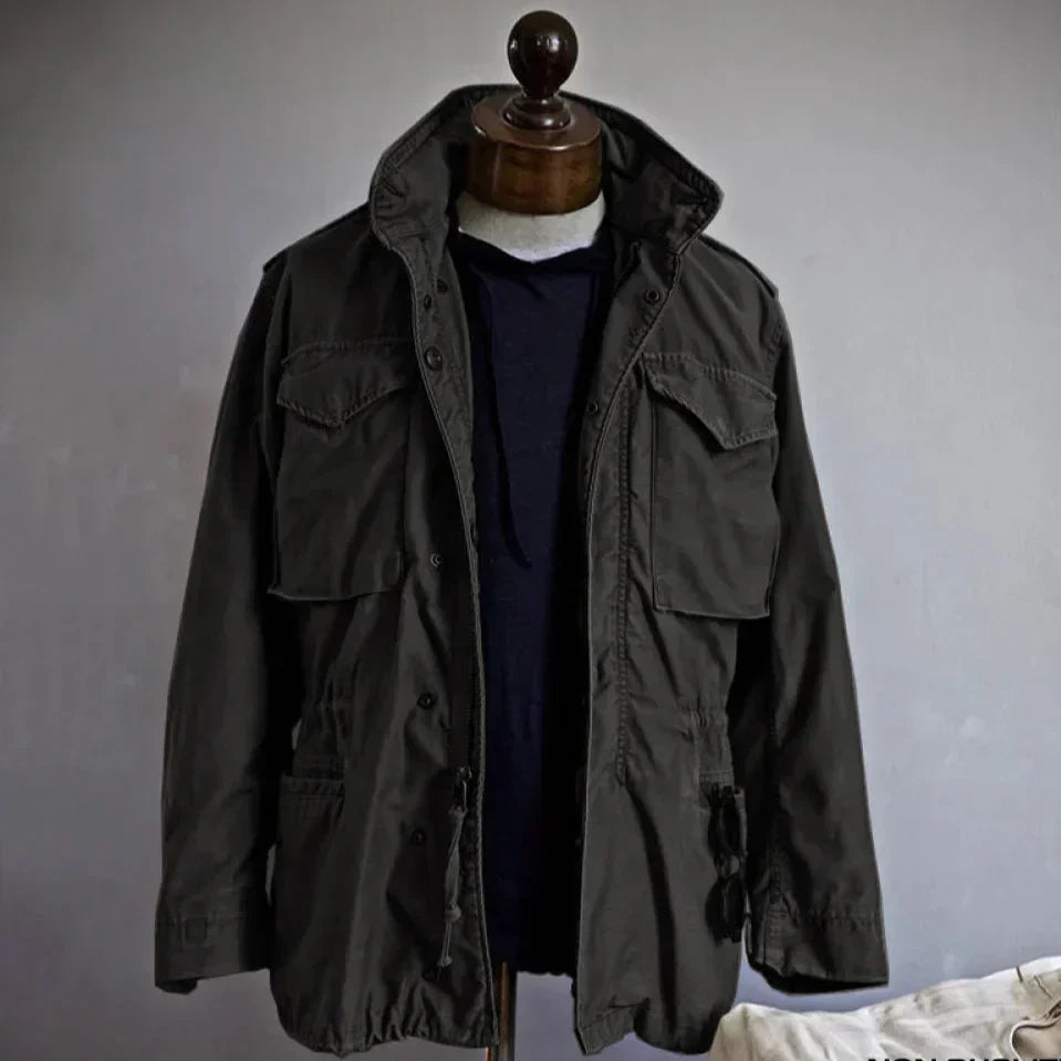 Men's long sleeve utility field jacket. Multi-pocket military-style outerwear for versatile casual and adventure fashion.