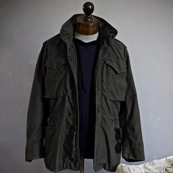 Men's long sleeve utility field jacket. Multi-pocket military-style outerwear for versatile casual and adventure fashion.