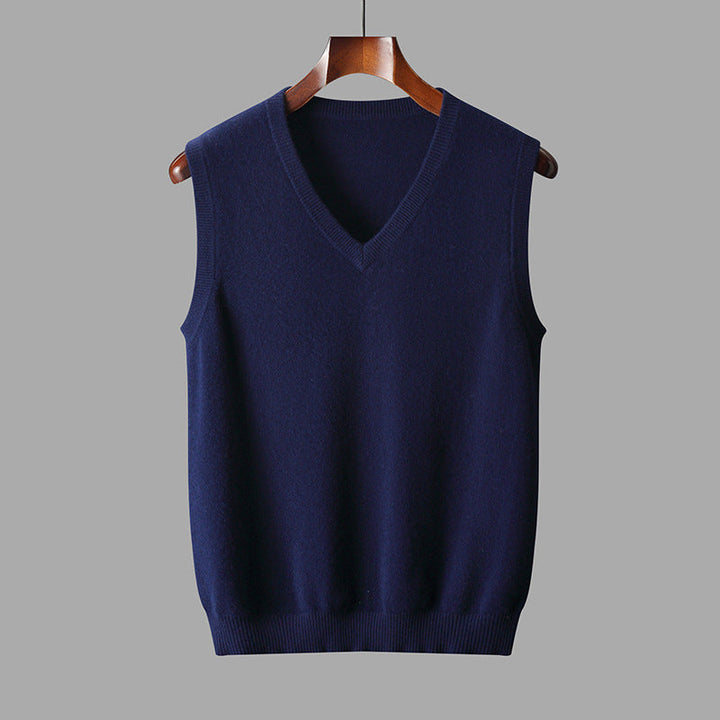 Men's V-neck sweater vest styled over a collared shirt for a sharp, sophisticated business casual look.