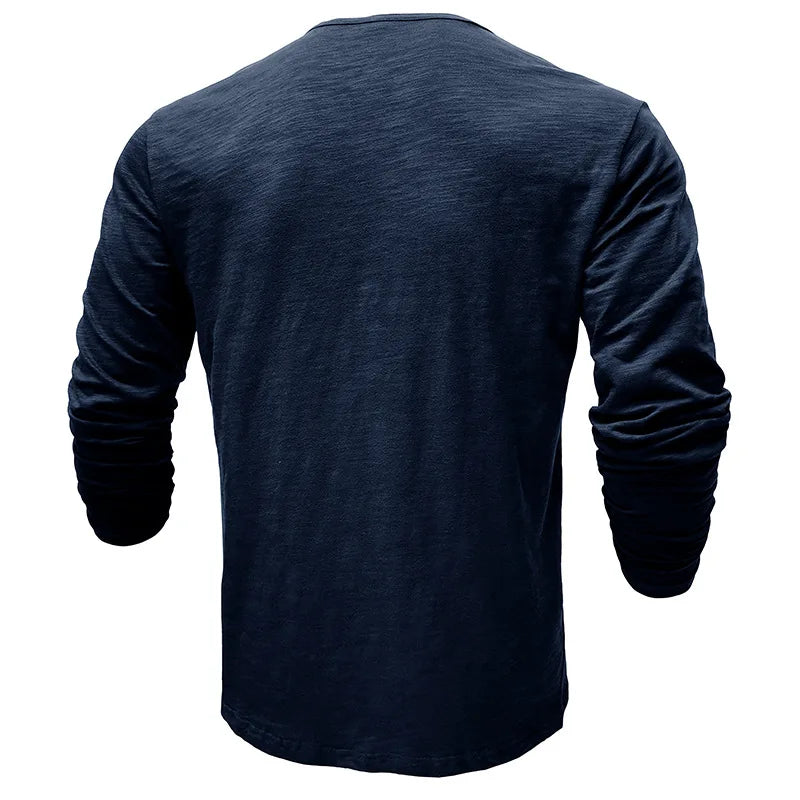 Man wearing a comfortable long-sleeve henley shirt, 7-button placket. Great for casual & smart casual outings.