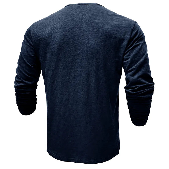 Man wearing a comfortable long-sleeve henley shirt, 7-button placket. Great for casual & smart casual outings.
