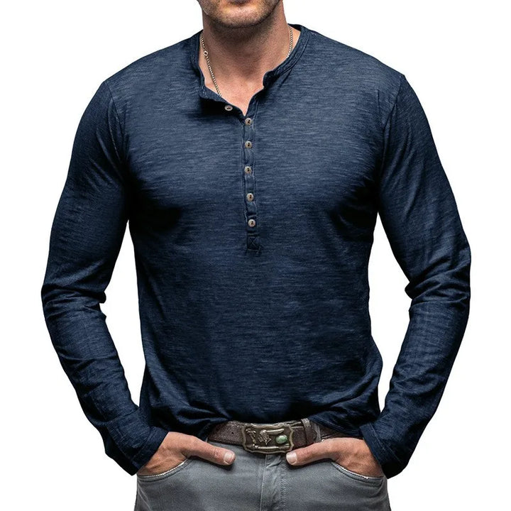 Close-up of 7-button placket on men's versatile long-sleeve henley shirt. Classic fit casual top.