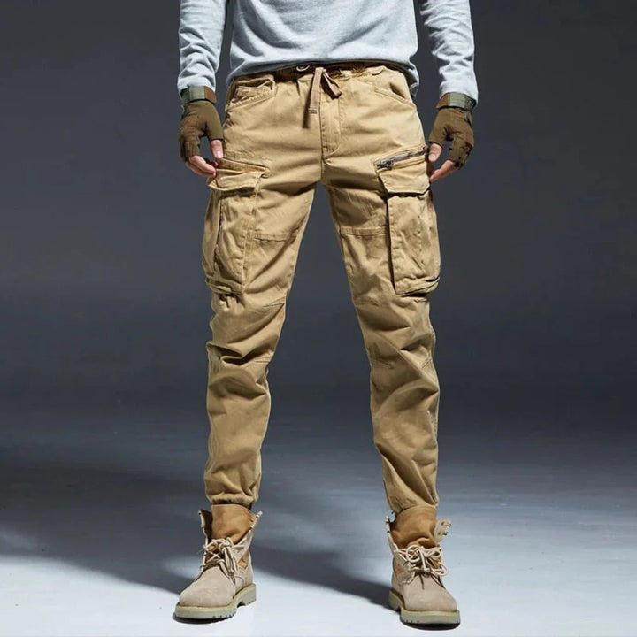 Men's versatile cargo pants, multi-pocket design, elastic waist for outdoor & casual comfort.