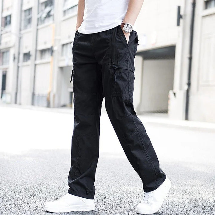 Khaki men's utility cargo pants with multiple pockets, comfortable for outdoor & everyday wear.