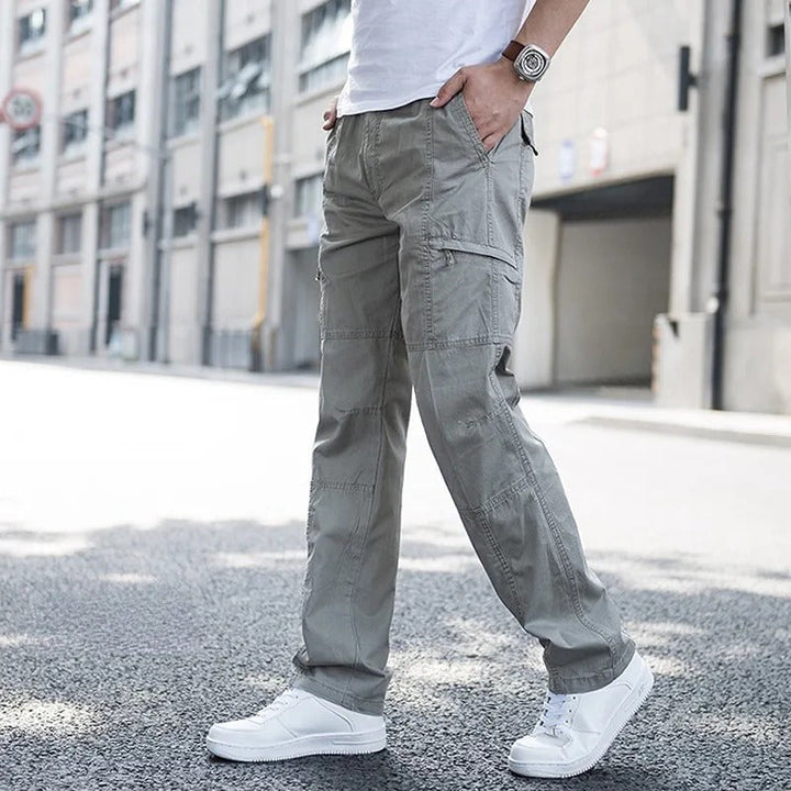 Grey men's relaxed fit cargo pants, comfortable and versatile, ideal for casual & outdoor use.