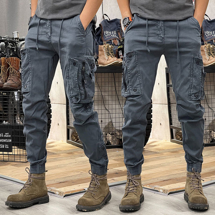 Stylish men's beige cargo pants with multi-pockets, offering comfort for casual & outdoor everyday fashion.