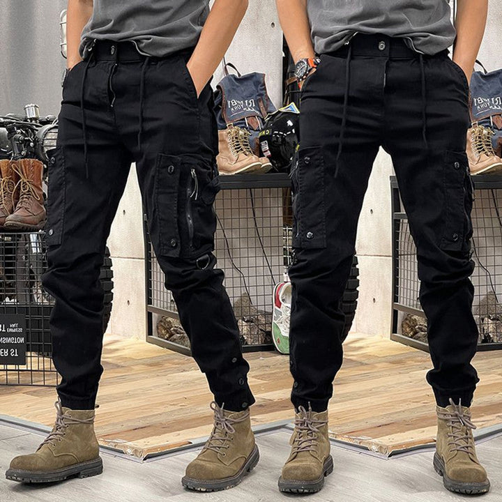 Men's grey multi-pocket cargo pants with a structured fit, combining utility & everyday fashion.