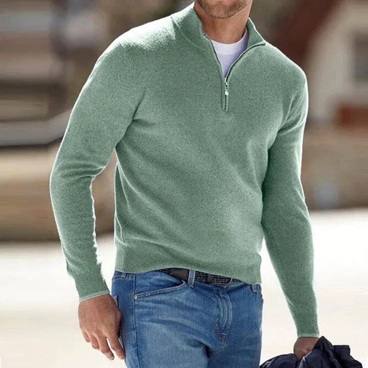 Close-up of a men's quarter-zip pullover, highlighting the zipper detail and soft fabric for comfort.