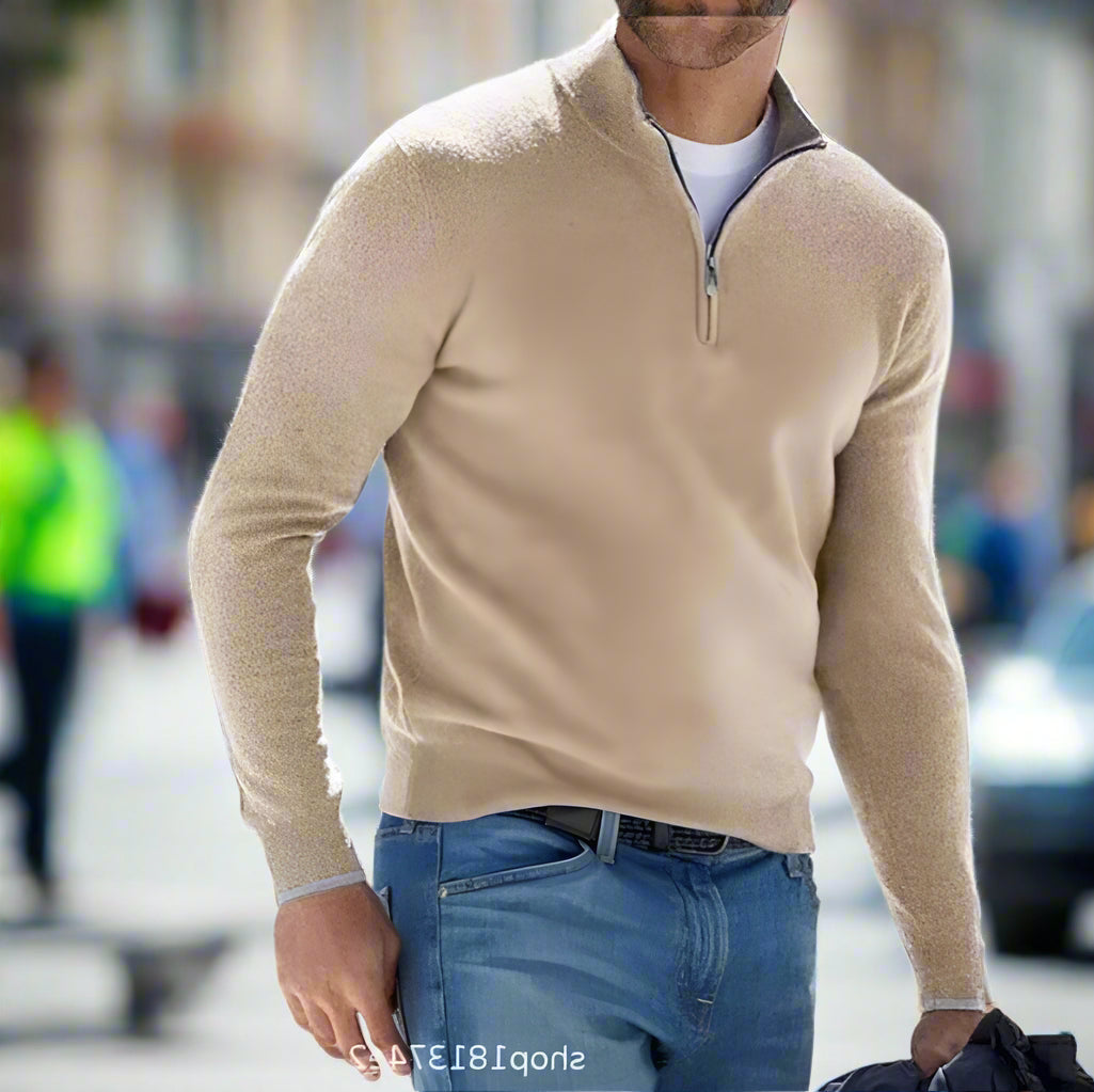 Modern men's quarter-zip sweater in a neutral tone, ideal for smart casual style and versatile layering.
