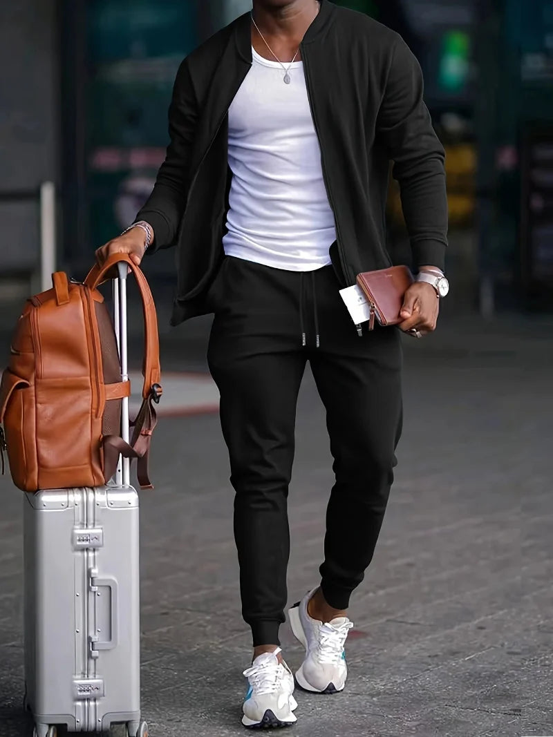 Men's versatile zip-up tracksuit set in a sporty design, perfect for comfort & style. Features jogger pants & jacket.