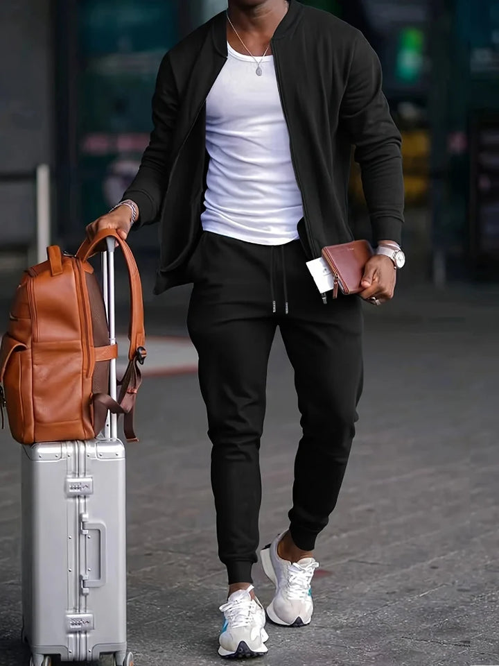 Men's versatile zip-up tracksuit set in a sporty design, perfect for comfort & style. Features jogger pants & jacket.