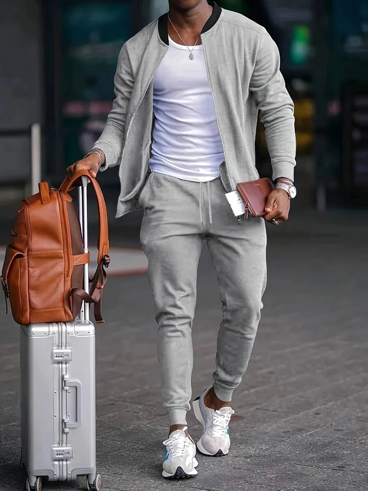 Sporty men's tracksuit set, ideal for autumn/spring travel. Comfy zip-up jacket & joggers for a stylish versatile outfit.