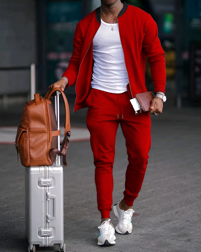 Comfortable men's zip-up jacket and matching jogger pants set. Stylish two-piece athletic wear for everyday outfits.