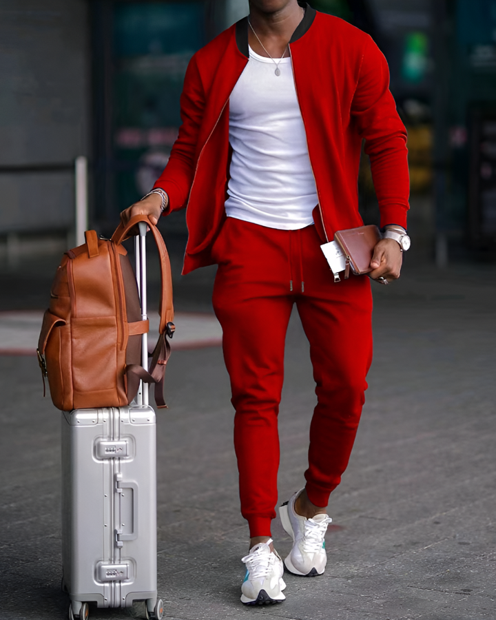 Comfortable men's zip-up jacket and matching jogger pants set. Stylish two-piece athletic wear for everyday outfits.