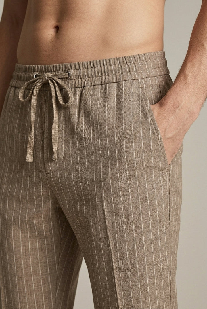 Stylish men's tapered pinstripe trousers, versatile for smart casual or comfortable everyday wear.