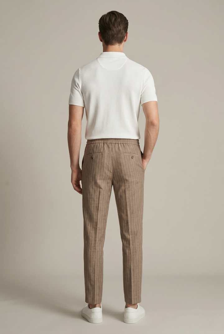 Comfortable men's pinstripe tapered trousers with an elastic waist, offering a modern smart casual fit.