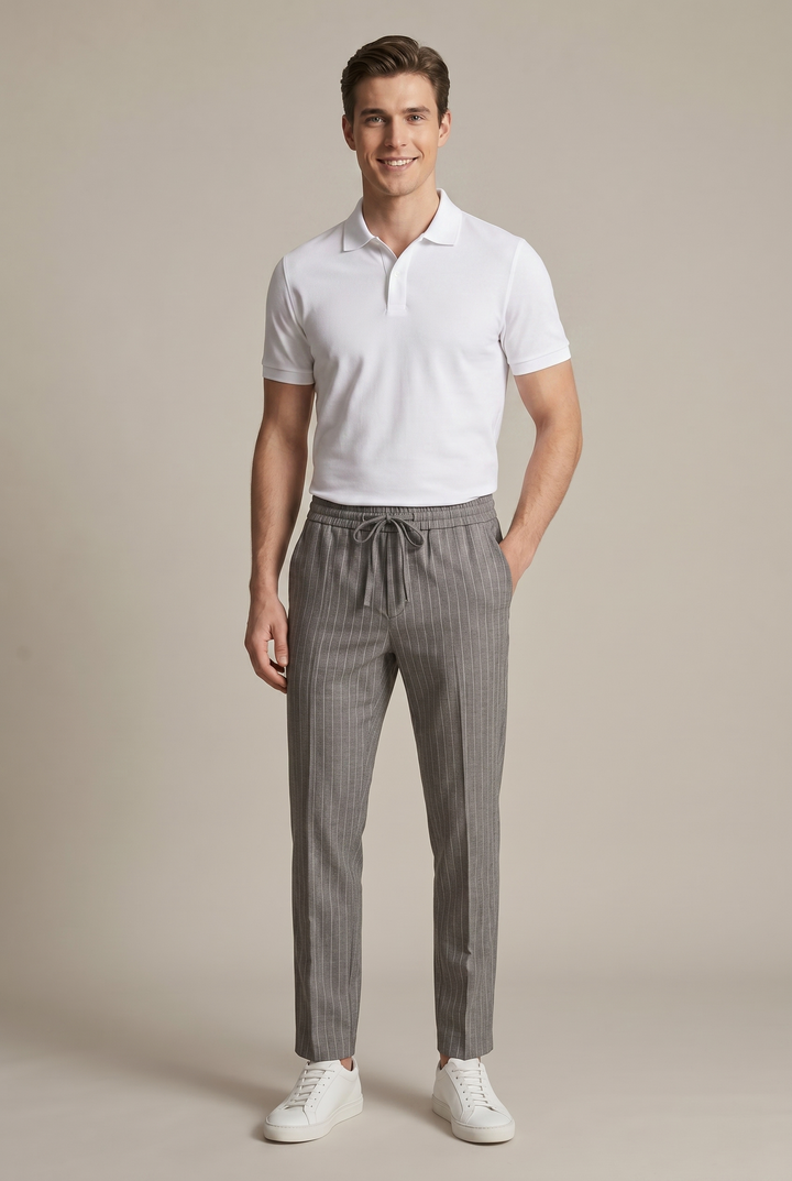 Vertical pinstripe men's trousers, a modern tapered cut for a sleek and stylish smart casual look.