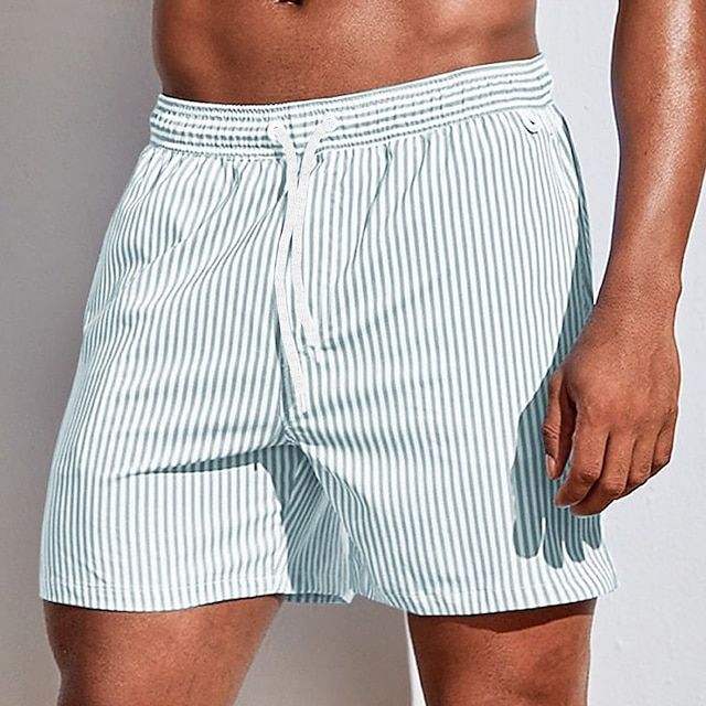 Comfortable men's quick-dry vertical stripe swim shorts. Drawstring summer beachwear for active days.
