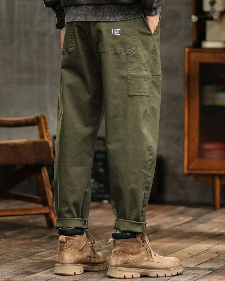 Khaki men's vintage cargo pants, relaxed fit utility trousers. Ideal for casual, outdoor, or streetwear outfits.