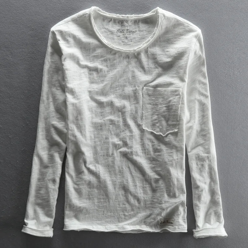 Model wearing a stylish men's vintage long sleeve crew neck tee, ideal for casual wear and fall fashion trends.