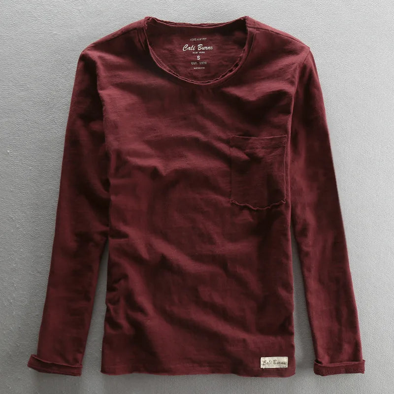 Folded men's vintage bamboo cotton long sleeve tee, highlighting its quality, comfort, and basic style.