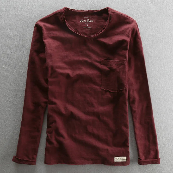 Folded men's vintage bamboo cotton long sleeve tee, highlighting its quality, comfort, and basic style.