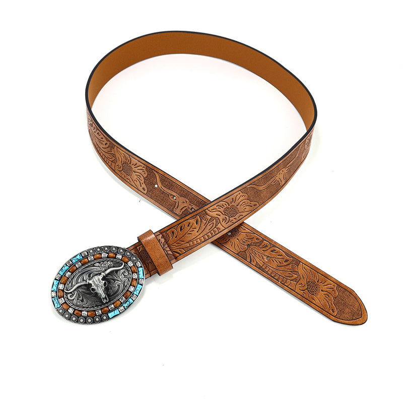Close-up of an ornate engraved buckle on a men's vintage western cowboy belt. High-quality PU leather.