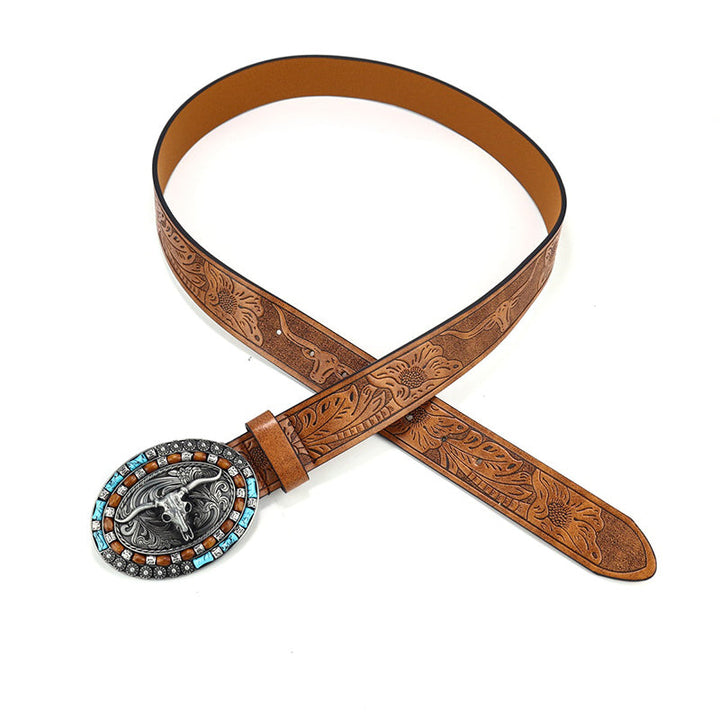 Close-up of an ornate engraved buckle on a men's vintage western cowboy belt. High-quality PU leather.