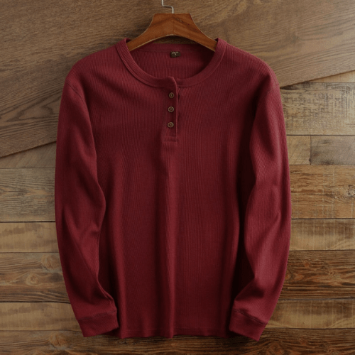 Soft men's waffle knit henley, long sleeve casual top. Durable textured shirt for men's apparel comfort.