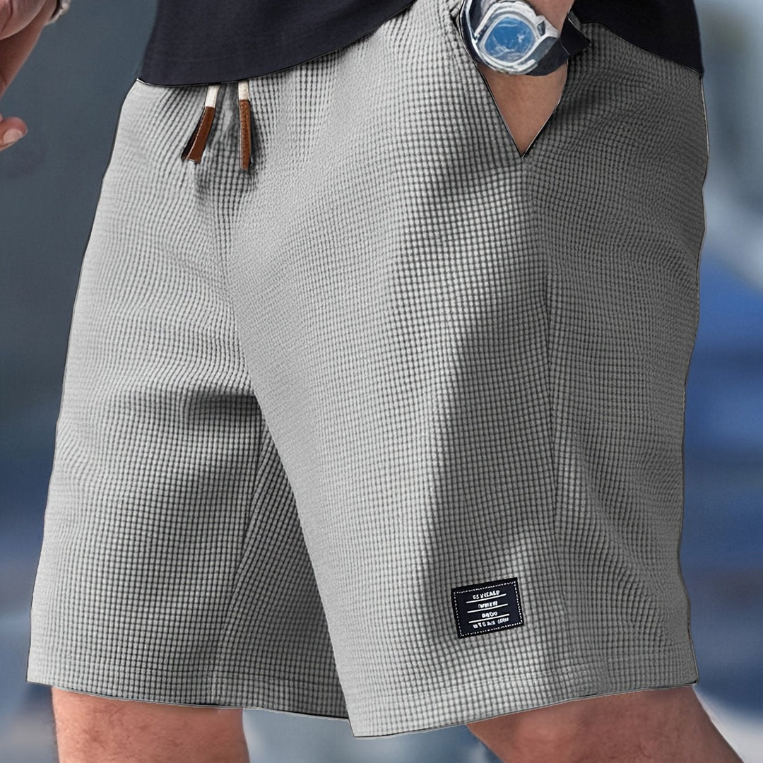 Stylish men's drawstring shorts. Breathable waffle texture, ideal for hot summer days.