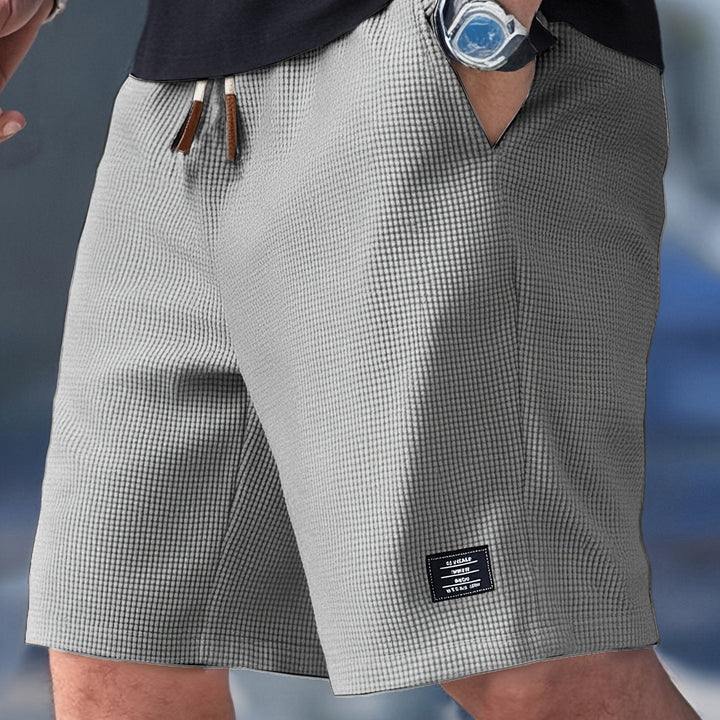 Stylish men's drawstring shorts. Breathable waffle texture, ideal for hot summer days.