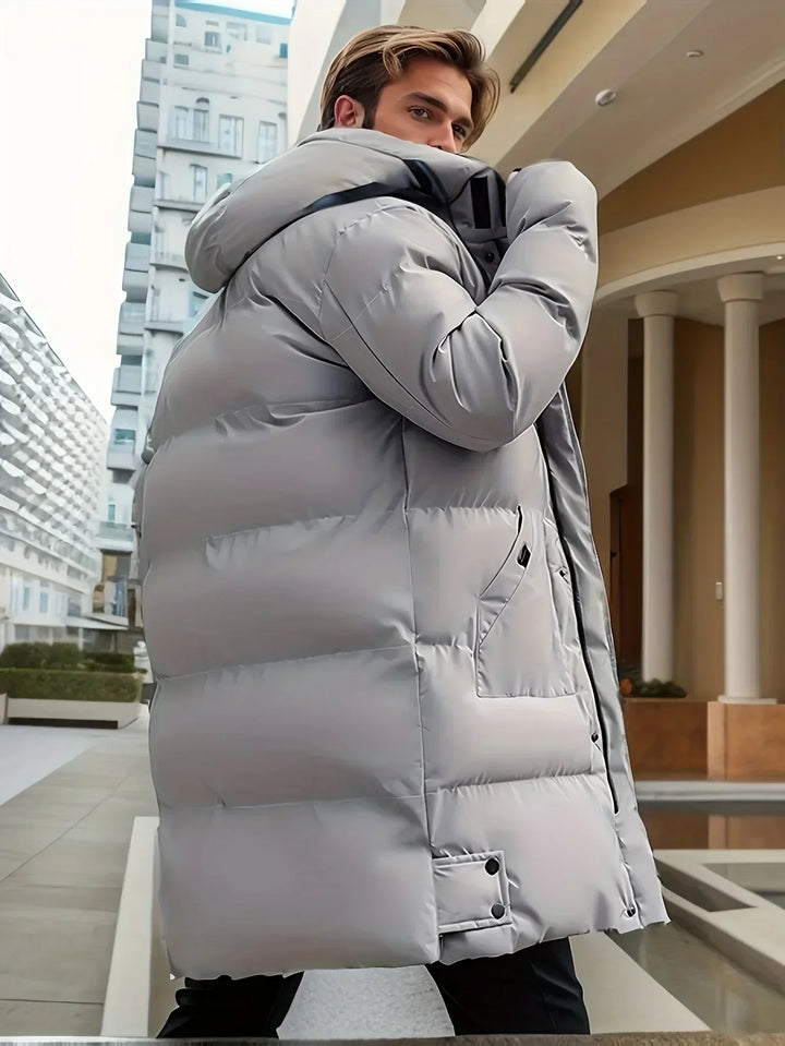Men's insulated hooded puffer jacket for versatile cold weather wear. Warm, stylish, and comfortable outerwear.
