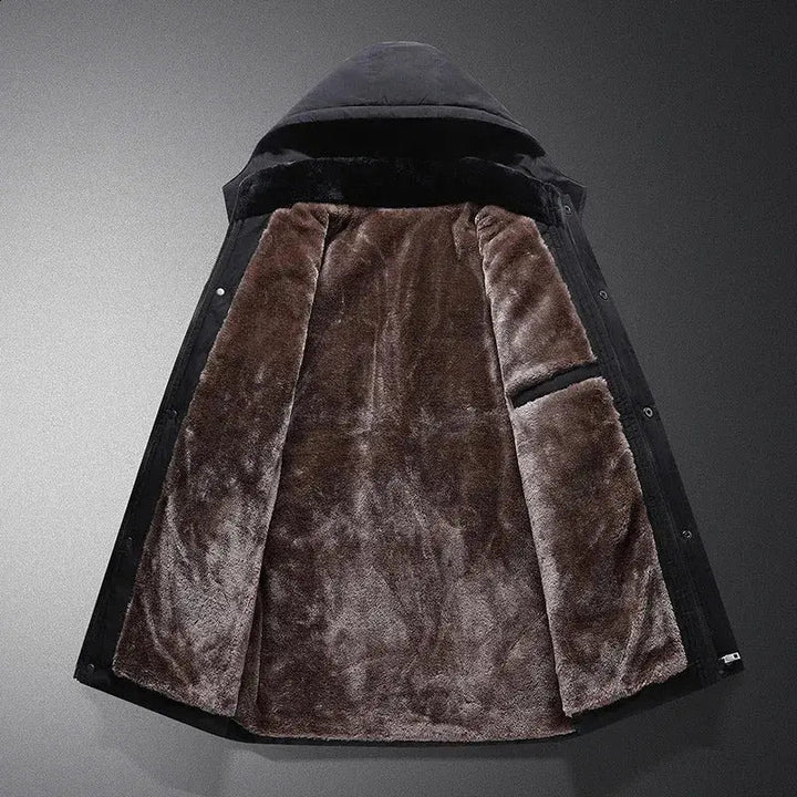 Close-up of a men's thermal padded jacket, showing durable zipper and warm hood for ultimate winter protection.