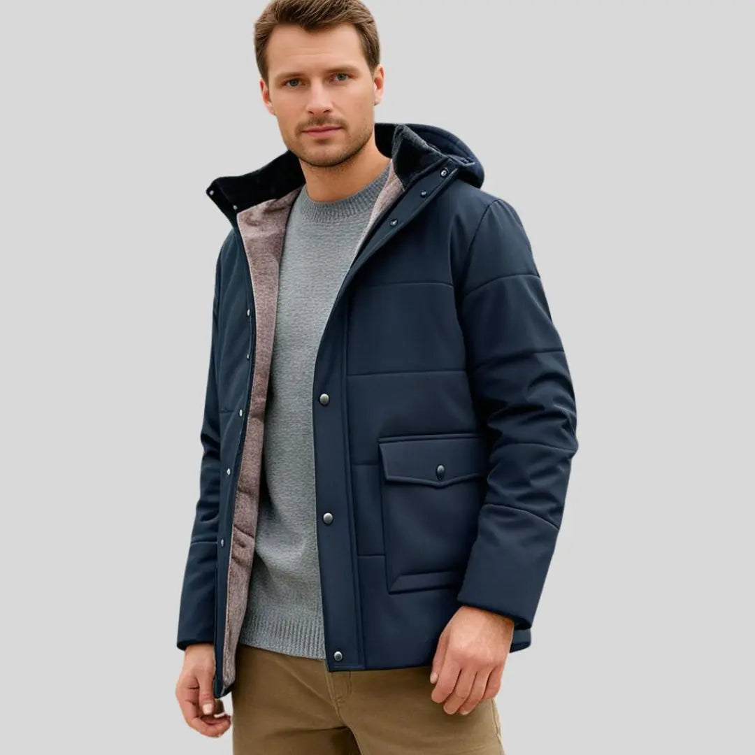 Textured close-up of a men's durable outdoor winter jacket, featuring weather-resistant fabric & thick insulation.