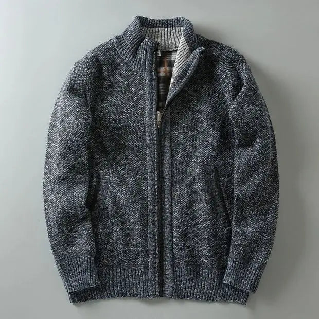 Detail of the high collar and durable zipper on a men's warm, fleece-lined knit jacket.