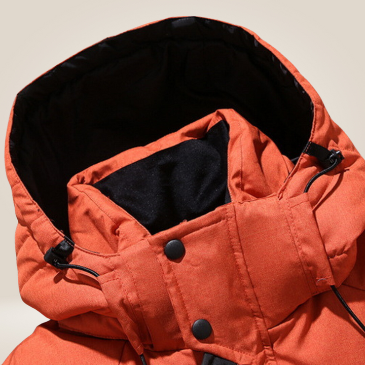 Orange men's warm winter parka. Waterproof, windproof insulated jacket for outdoor activities.