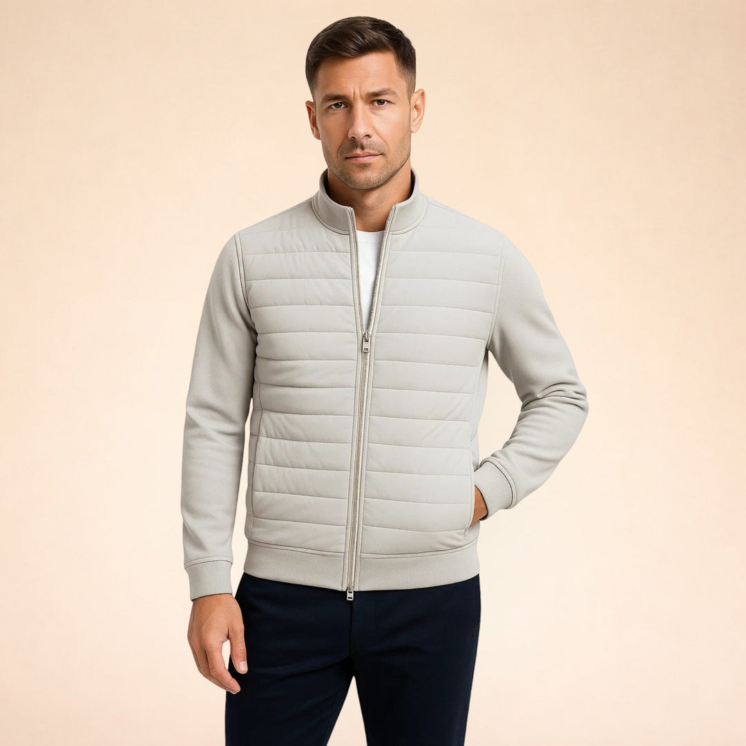 Lightweight men's hybrid jacket with quilted body and flexible stretch knit sleeves for ultimate comfort & warmth.