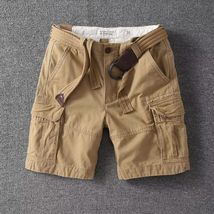 Relaxed fit men's washed cargo shorts with utility pockets. Essential streetwear bottoms for summer casual wear.