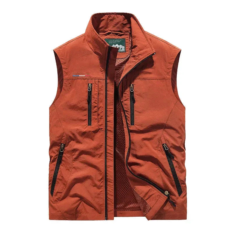 Utility men's waterproof vest with multi-pockets, ideal for keeping dry & warm during outdoor adventures.