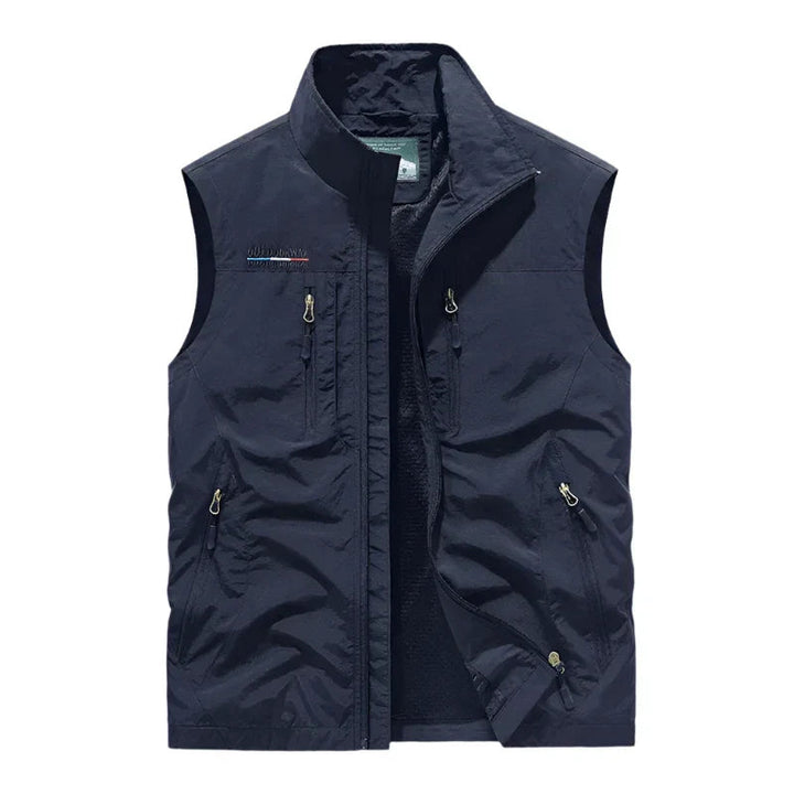Lightweight men's waterproof gilet, a durable weather-resistant vest for comfortable outdoor wear & travel.