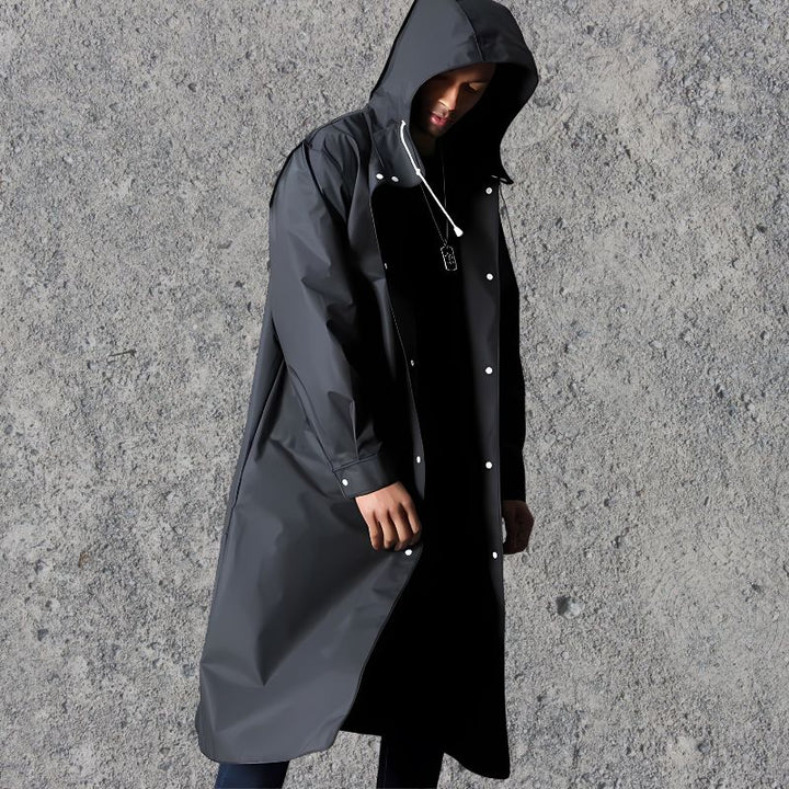 Stylish men's knee-length waterproof rain jacket with hood, ideal lightweight outerwear for city exploration & travel.