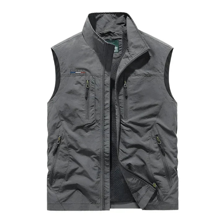 Warm and dry men's outdoor vest. Insulated & waterproof for ultimate comfort in cold, wet conditions. All-season outerwear.