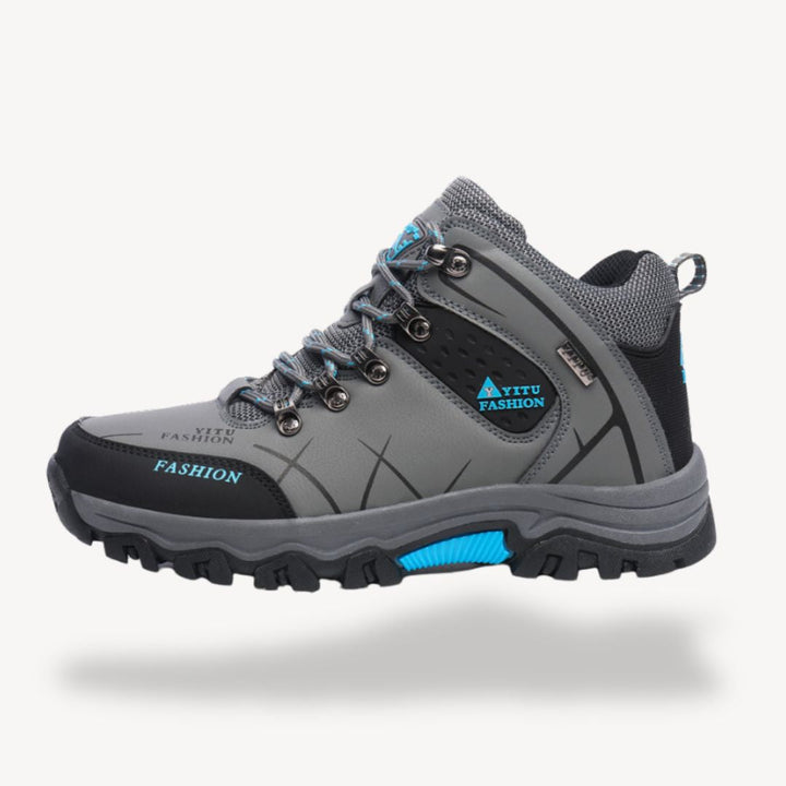 High-performance men's waterproof hiking boots with orthopedic insoles, built for demanding trail adventures.
