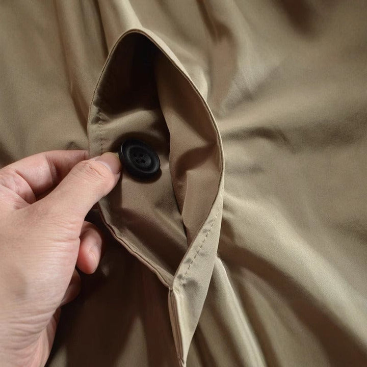 Warm and functional men's weatherproof long coat, featuring a button-front design for insulated comfort.