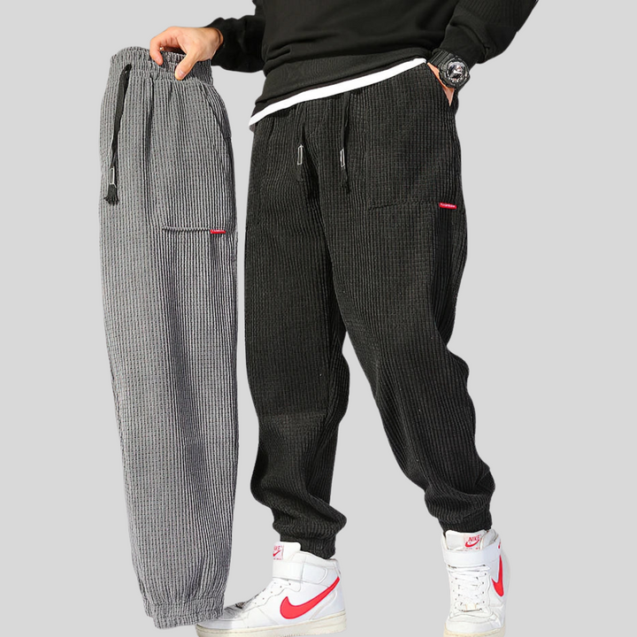 New men's wide corduroy joggers for ultimate comfort. Relaxed fit, textured pants for modern casual style.