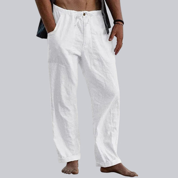 Men's wide leg summer trousers in a light color, perfect for casual, elegant, and relaxed beachwear comfort.