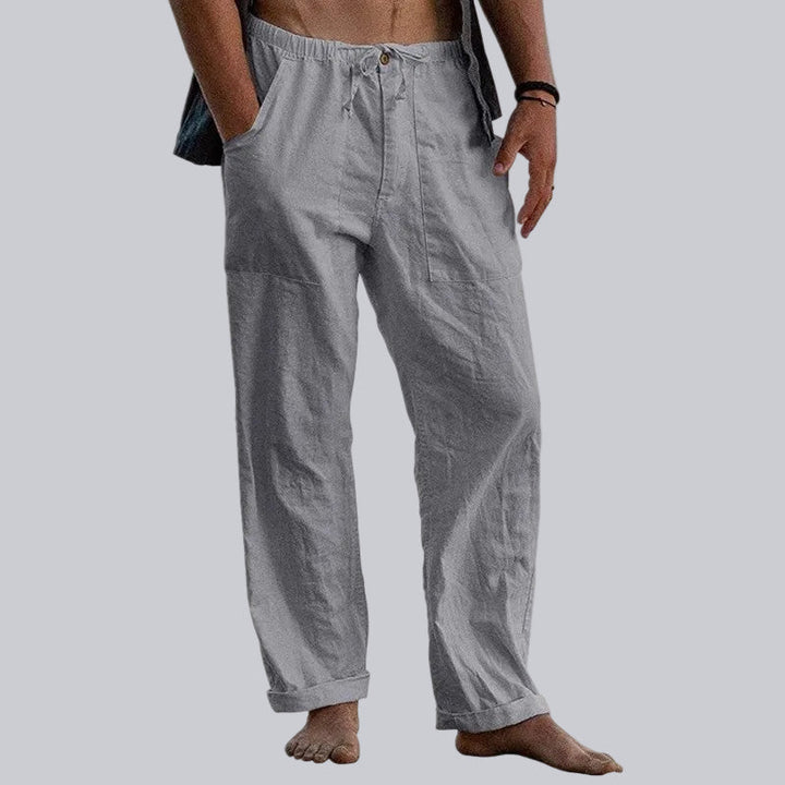 Stylish men's wide leg beach trousers, lightweight and breathable for summer comfort and relaxed elegance.